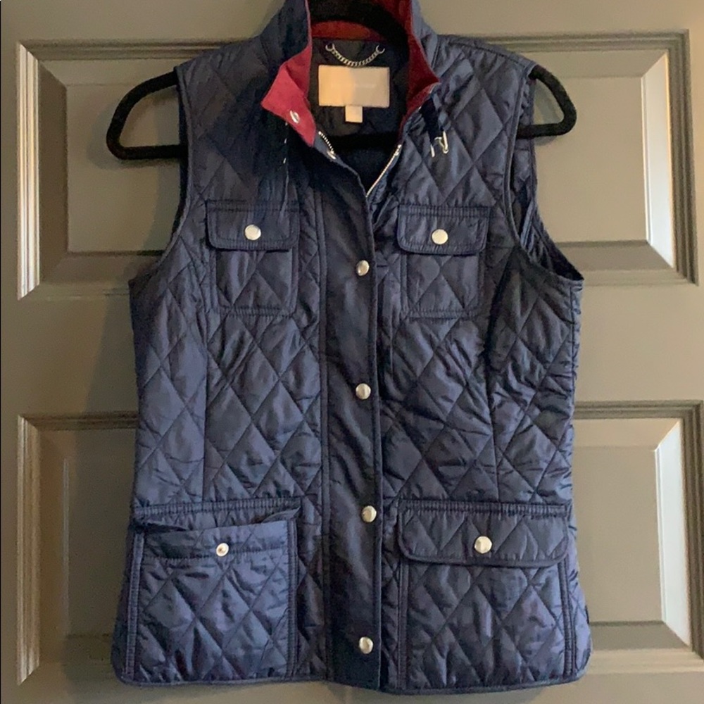 Blue vest with red and silver detail